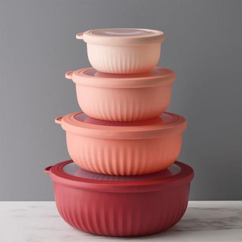A set of four nesting bowls with lids